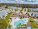 Irregular-shaped pool with spa and surrounding patio at 455 Alt 19 S # 163, Palm Harbor, FL 34683