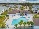 Irregular-shaped pool with spa and surrounding patio at 455 Alt 19 S # 163, Palm Harbor, FL 34683