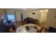 Dining area with wood flooring and a round dining table at 5031 6Th N Ave, St Petersburg, FL 33710