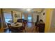Bright living room with dining area, hardwood floors, and view to backyard at 5031 6Th N Ave, St Petersburg, FL 33710