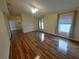 Living room features wood flooring, neutral walls and multiple windows at 5031 6Th N Ave, St Petersburg, FL 33710