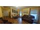 Living room features wood flooring, neutral walls and large windows at 5031 6Th N Ave, St Petersburg, FL 33710