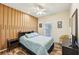 Bedroom with wood floors and an accent wall at 5452 Queen Ave, Spring Hill, FL 34609