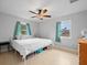 Spacious bedroom with large bed and ceiling fan at 7180 Tarrytown Dr, Spring Hill, FL 34606