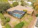 Aerial view of house and pool with landscaping at 8480 Athens Ct, Weeki Wachee, FL 34613