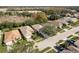 A high aerial view shows a line of residential homes with front-facing garages and grassy lawns at 14120 Whitecap Ave, Hudson, FL 34667