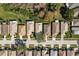 Overhead view of a residential neighborhood with neat lawns, driveways, and various roof styles at 14120 Whitecap Ave, Hudson, FL 34667
