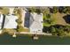 Aerial view showing house, dock, and waterfront location at 3207 Hibiscus Dr, Hernando Beach, FL 34607
