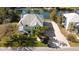 Aerial view of waterfront home with private dock and lush landscaping at 3207 Hibiscus Dr, Hernando Beach, FL 34607