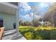 Spacious backyard with grassy area and mature trees at 3207 Hibiscus Dr, Hernando Beach, FL 34607