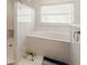 Bathroom with soaking tub, shower, and marble flooring at 3207 Hibiscus Dr, Hernando Beach, FL 34607