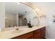 Double vanity bathroom with decorative wallpaper at 3207 Hibiscus Dr, Hernando Beach, FL 34607