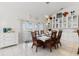 Dining room features a large table, wicker chairs, and built in hutch at 3207 Hibiscus Dr, Hernando Beach, FL 34607
