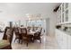 Bright dining room with wicker chairs and access to a balcony at 3207 Hibiscus Dr, Hernando Beach, FL 34607
