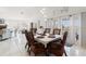 Spacious dining area with wicker chairs and access to balcony at 3207 Hibiscus Dr, Hernando Beach, FL 34607