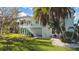 Elevated home with wrap around porch and staircase at 3207 Hibiscus Dr, Hernando Beach, FL 34607