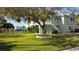 Side view of house highlighting landscaping and waterfront location at 3207 Hibiscus Dr, Hernando Beach, FL 34607