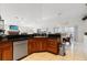 Spacious kitchen with wood cabinets, granite countertops, and stainless steel appliances at 3207 Hibiscus Dr, Hernando Beach, FL 34607