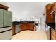 Large kitchen with wood cabinets and granite counters at 3207 Hibiscus Dr, Hernando Beach, FL 34607