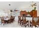 Open concept kitchen and dining area with breakfast bar and view to the water at 3207 Hibiscus Dr, Hernando Beach, FL 34607