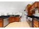 Modern kitchen with wood cabinets and granite countertops at 3207 Hibiscus Dr, Hernando Beach, FL 34607