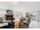 Comfortable living room with fireplace and view of the water at 3207 Hibiscus Dr, Hernando Beach, FL 34607