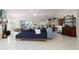 Bright living room with vaulted ceilings, fireplace, and access to a balcony at 3207 Hibiscus Dr, Hernando Beach, FL 34607