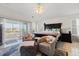 Main bedroom with king-size bed and access to a private balcony at 3207 Hibiscus Dr, Hernando Beach, FL 34607