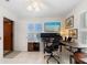 Home office with standing desk, monitors, and view at 3207 Hibiscus Dr, Hernando Beach, FL 34607