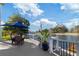 Relaxing patio overlooking the water with seating for dining and enjoying the view at 3207 Hibiscus Dr, Hernando Beach, FL 34607