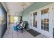 Spacious screened balcony with seating and water views at 3207 Hibiscus Dr, Hernando Beach, FL 34607