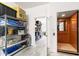 Convenient storage area with shelving and elevator access at 3207 Hibiscus Dr, Hernando Beach, FL 34607