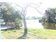 Backyard oasis with a deck overlooking a tranquil lake at 3518 Moog Rd, Holiday, FL 34691