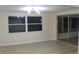 Spacious dining area with large windows and sliding glass doors at 3518 Moog Rd, Holiday, FL 34691