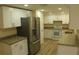 Modern kitchen with stainless steel appliances and granite countertops at 3518 Moog Rd, Holiday, FL 34691