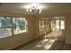 Bright living room with sliding glass doors to a sunroom at 3518 Moog Rd, Holiday, FL 34691