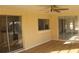 Bright sunroom with sliding glass doors and wood-look flooring at 3518 Moog Rd, Holiday, FL 34691
