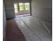 Living room space with sliding glass door to backyard getting renovations with new drywall for a modern touch at 4829 Onyx Ln # 102, New Port Richey, FL 34652