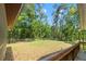 Expansive fenced backyard with mature trees and lush lawn, perfect for outdoor enjoyment at 6051 Valley Spring Dr, Brooksville, FL 34601
