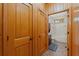 This home's bathroom features natural wood trim, brick floors and a shower and tub combo at 6051 Valley Spring Dr, Brooksville, FL 34601