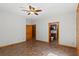 A bedroom with adjacent bathroom featuring neutral paint and wood trim accents at 6051 Valley Spring Dr, Brooksville, FL 34601