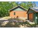 Log cabin home featuring shingle roofing and stone foundation detail at 6051 Valley Spring Dr, Brooksville, FL 34601