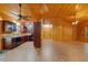 Open concept kitchen with wood walls, cabinets and ceilings plus modern appliances at 6051 Valley Spring Dr, Brooksville, FL 34601