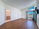 Bright bedroom with wood floor and large window overlooking the backyard at 9519 Green Needle Dr, New Port Richey, FL 34655