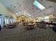 Spacious event space with ample seating, a stage, and a fireplace provides an elegant setting for various occasions at 9519 Green Needle Dr, New Port Richey, FL 34655