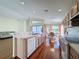 Kitchen with breakfast bar, wood cabinetry, and adjacent dining area with scenic views at 9519 Green Needle Dr, New Port Richey, FL 34655
