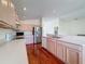Functional kitchen featuring wood cabinets, a breakfast bar, and modern appliances at 9519 Green Needle Dr, New Port Richey, FL 34655
