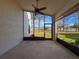 Unfurnished lanai featuring a ceiling fan, and scenic backyard views at 9519 Green Needle Dr, New Port Richey, FL 34655