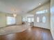 Spacious living room featuring carpeted floors and large windows for natural light at 9519 Green Needle Dr, New Port Richey, FL 34655
