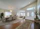 Bright living room with dining area featuring hardwood floors and a chandelier at 9519 Green Needle Dr, New Port Richey, FL 34655
